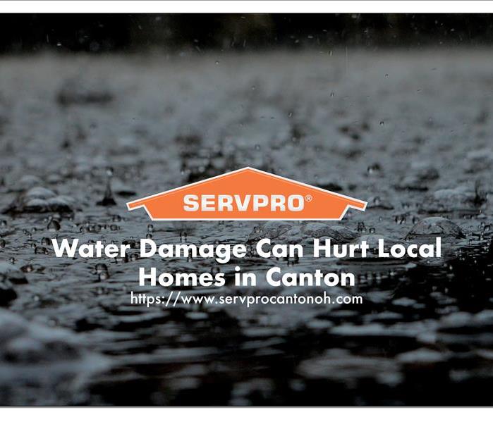 Orange SERVPRO  house logo on dark image with water 